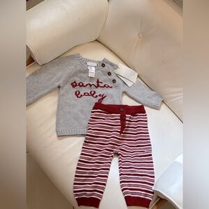 New with tags elegant baby size 12m Santa baby sweater and pant set.
